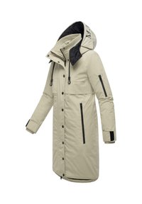 Beige parka met een zwarte capuchon en voering. Kenmerken zijn onder andere ritssluitingen, drukknoopsluitingen en elastische manchetten voor extra warmte.