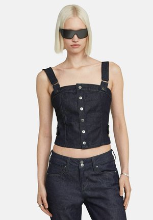 Denim crop top with wide straps, silver buttons down the front, dark wash, fitted design, and textured fabric. Adjustable side accents.