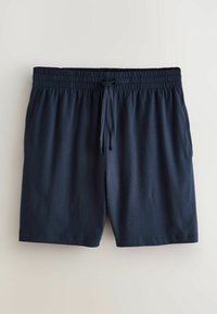 Granatowe casualowe spodenki z elastycznym pasem i sznurkiem, wykonane z lekkiego materiału, ułożone na płasko na jasnym tle.