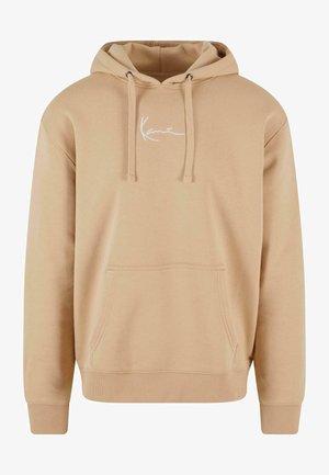 Bežinė džemperis su gobtuvu, priekyje turi kengūros stiliaus kišenę, su pamamagitan virvelę ir baltu siuvinėjimu ant krūtinės. Minkštas audinio paviršius.