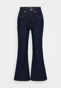 Jeans de ganga de cintura alta azul escuro com pernas largas, fecho frontal com botão e zipper, e costura laranja contrastante.