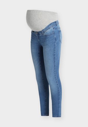 Jeans albastri de maternitate cu o talie elastică gri, proiectată pentru a se adapta unui burta de gravidă, expuse pe un fundal alb.