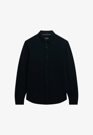 Camisa negra de manga larga hecha de algodón, con cierre de botones en el frente, cuello puntiagudo y un sutil bordado del logo en el pecho.