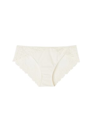 Cremefarvede blondetrusser til kvinder med blomsterprint på linningen og kanterne, vist på hvid baggrund.