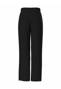 Pantalons larges noirs en tissu texturé avec une taille élastique. Le design ne présente pas de poches visibles ni de hardware supplémentaire.