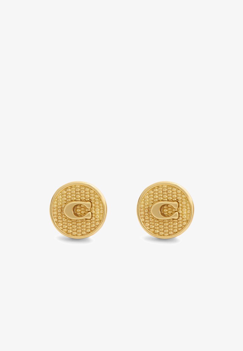 Boucles d'oreilles clous rondes ton or avec motif texturé et logo C en relief au centre sur fond blanc.