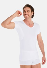White fitted short-sleeve t-shirt with a V-neck and smooth texture, designed for comfort and layering under clothing.