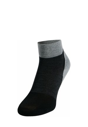 Chaussette de cheville noire et grise avec un design en blocs de couleur. Fabriquée en tissu doux, elle possède un bord côtelé et une couture de orteil lisse pour un confort optimal.