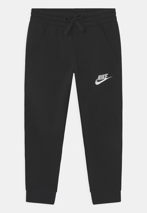 Schwarze Jogginghose aus Baumwollmischung, mit elastischem Bund und Kordelzug, seitlichen Taschen und einem weißen Nike-Logo am Oberschenkel.