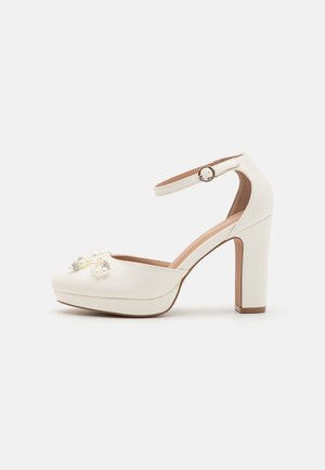 Højhælede pumps - white