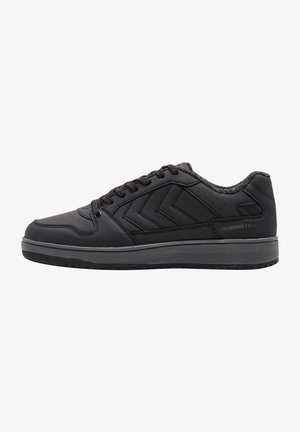 Black sneaker with a smooth leather exterior, featuring a low profile, round toe, flat sole, and herringbone pattern accents on the side.