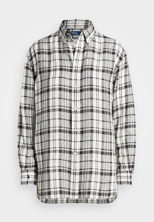 Chemise à manches longues à boutons avec un motif à carreaux noir, blanc et gris, dotée d'un col boutonné et d'un logo brodé sur le poignet.