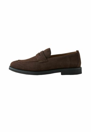 Dark brown suede men's loafer with black sole and a strap detail across the upper part, shown in side profile.