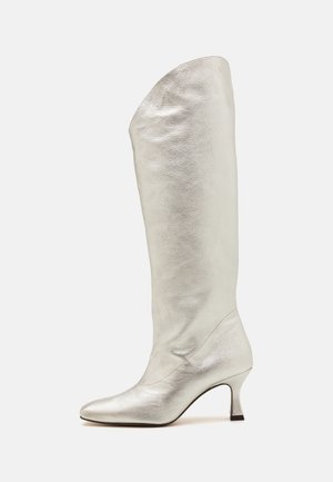 Silver leather knee-high boot with a pointed toe and a low, curved heel. Features a smooth, textured surface and a folded top design.