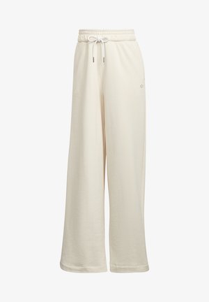 Wijde, crèmekleurige sweatpants met een elastische tailleband en witte trekkoord, met een klein subtiel logo aan de rechterkant.