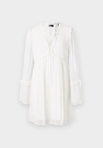 White long-sleeve dress with a V-neck, ruffled edges, and a drawstring tie at the waist. Made from lightweight, sheer fabric.