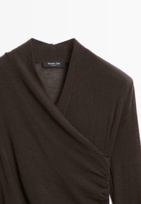 Dark brown wrap-style long sleeve top with V-neck and gathered side detail, labeled Massimo Dutti, made in China.