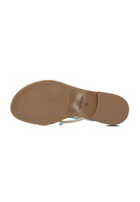 Sandal sole with a smooth, light brown finish. Features a slight heel and branded details. The underside has a textured surface for grip.