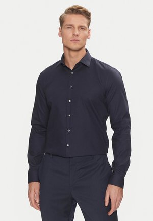 Maglietta a maniche lunghe blu navy con un motivo testurizzato, chiusura con bottoni e colletto strutturato. Presenta bottoni argentati e un design slim fit.