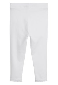 Witte katoen leggings met een strakke pasvorm, voorzien van een ruches aan de enkels en een gladde, zachte textuur door het hele materiaal.