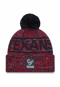 Knitted beanie in red and navy with a black pom-pom on top. Features "TEXANS" woven into the design and a logo patch on the cuff.