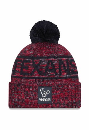 Knitted beanie in red and navy with a black pom-pom on top. Features "TEXANS" woven into the design and a logo patch on the cuff.