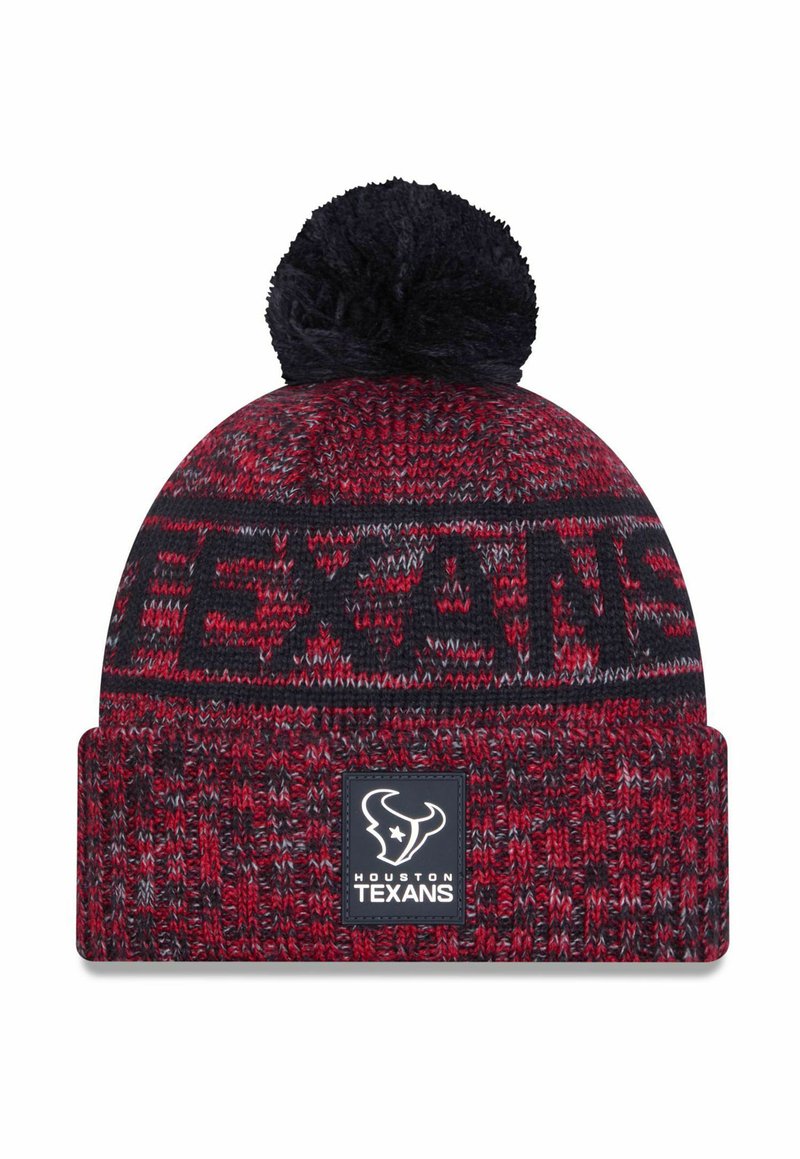 Knitted beanie in red and navy with a black pom-pom on top. Features "TEXANS" woven into the design and a logo patch on the cuff.