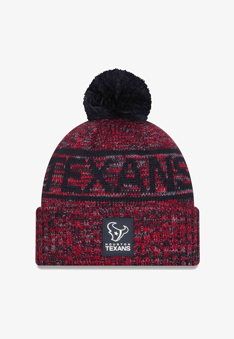 Knitted beanie in red and navy with a black pom-pom on top. Features "TEXANS" woven into the design and a logo patch on the cuff.