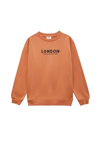 Oranje sweatshirt met een ronde hals en lange mouwen. Op de voorkant staat "LONDEN" in het zwart, met daaronder een slogan.