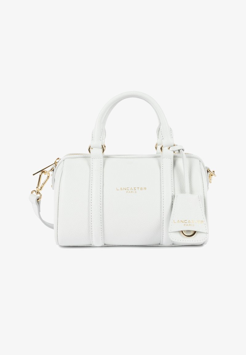 Sac à main Lancaster Paris en cuir blanc avec double poignée, bandoulière amovible, ferrures dorées et logo frontal.