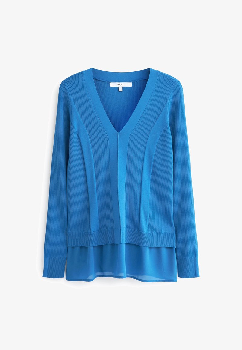 Pull bleu à manches longues avec col en V, motif en maille côtelée et empiècement en tissu transparent à l'ourlet, étiquette « NEXT » à l’intérieur du col.