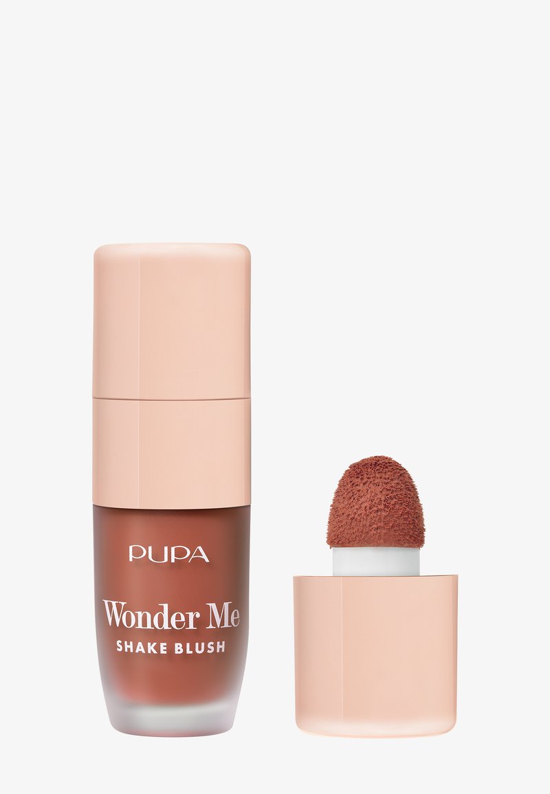 Pupa Wonder Me Shake Blush verfügt über eine Glasflasche mit einem softrosafarbenen Deckel, einem runden Applikator mit texturierter Spitze in einem rosabraunen Farbton.
