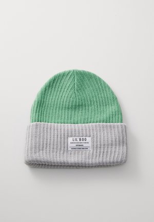 Knitted beanie featuring a green top and a gray ribbed cuff. Includes a label with brand name and details. Soft texture.