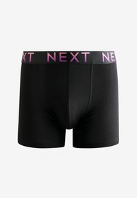 Boxeri negri din material moale cu un elastic lat negru, având inscripționat în relief textul roz "NEXT".