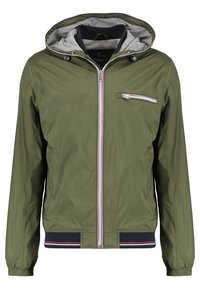 Veste à capuche zippée pour homme vert olive avec doublure intérieure grise, fermeture éclair sur la poche poitrine et poignets et ourlet élastiques rayés.