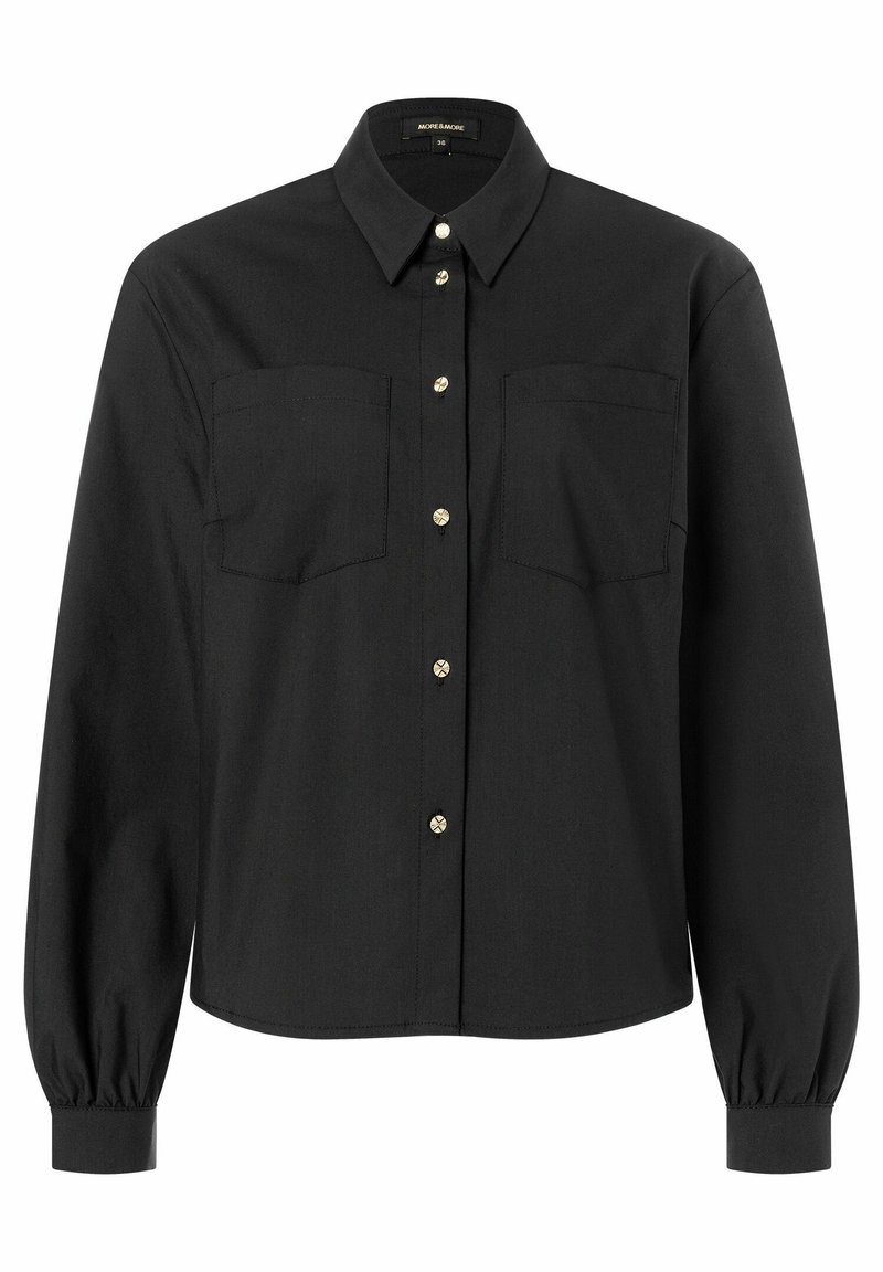 Schwarze Knopfhosenbluse aus glattem Stoff. Verfügt über zwei Brusttaschen und goldene Knöpfe, mit langen Ärmeln und gerafften Manschetten.