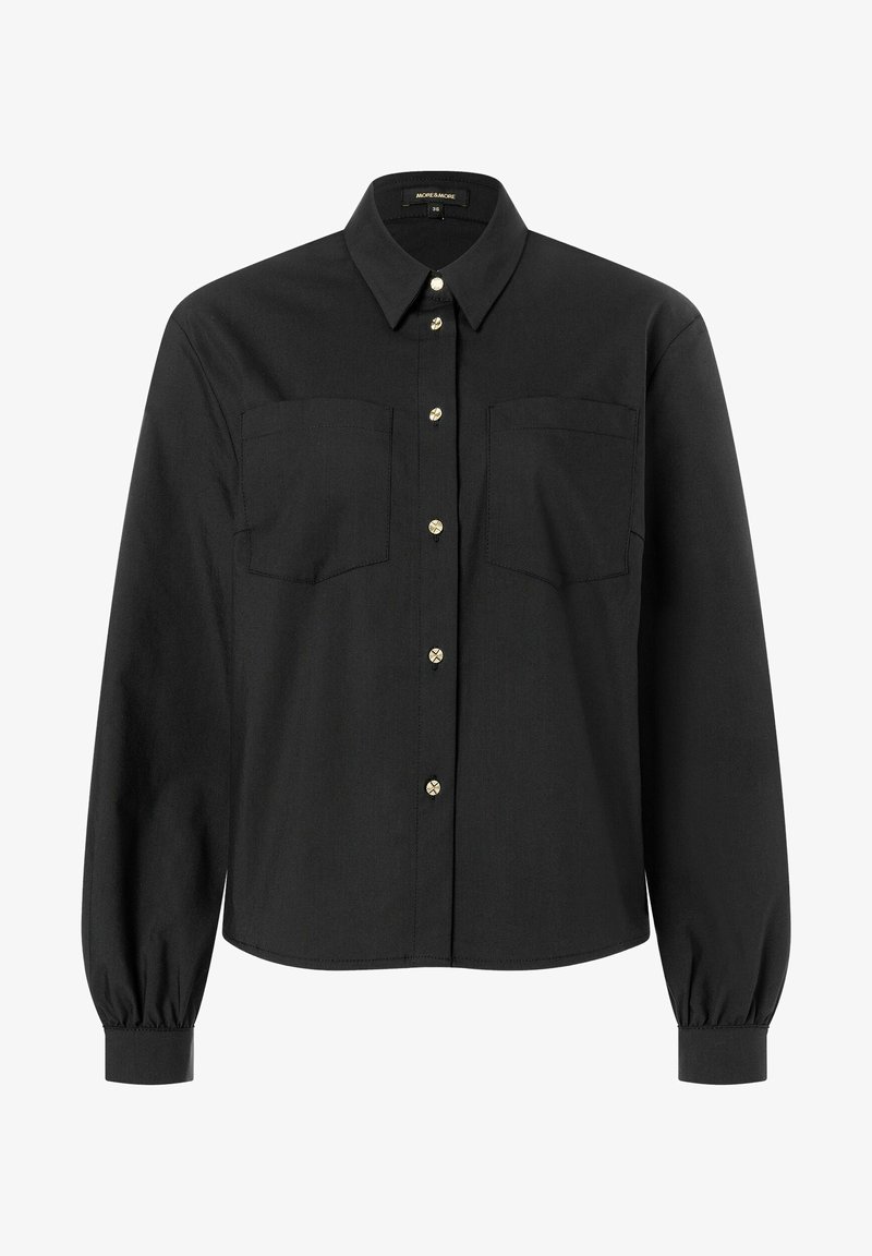 Black button-up shirt made of smooth fabric. Features two chest pockets and gold buttons, with long sleeves and gathered cuffs.