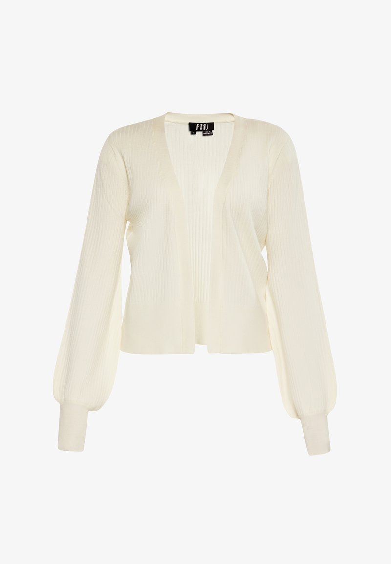Cardigan värviga koor, millel on ribatud tekstuur, avatud esiosa disain, pikad puhv-sleeves ja kitsenevad mansetid. Kerge kudumismaterjal.
