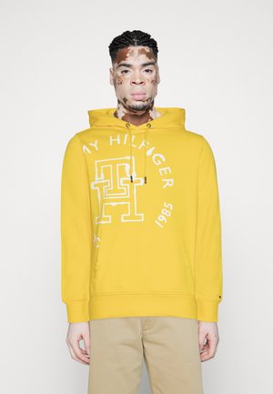 Tommy Hilfiger MONOGRAM INK ROUNDEL - Sweat à capuche - vivid yellow