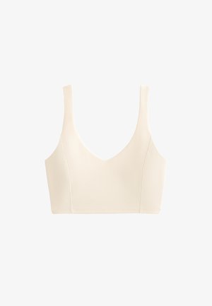 Geribbelde bralette in lichtbeige met een brede halslijn, stevige banden en een aangesloten pasvorm. Gladde textuur zonder extra patronen of versieringen.