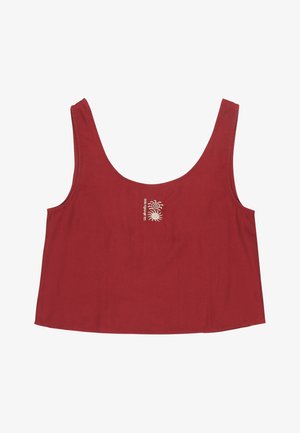 Haut court rouge sans manches avec larges bretelles et petit motif blanc de soleil et de vague centré sous l'encolure.