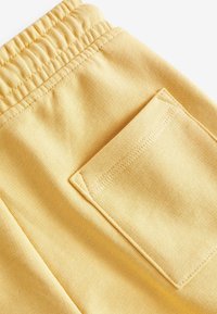 Next Pantalon de survêtement - buttermilk yellow
