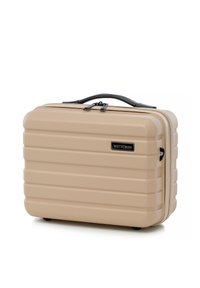 Valigia rigida beige con superficie texturizzata, design scanalato, doppia zip e maniglia nera. Presenta un logo del marchio sul fronte.