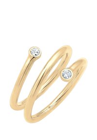 Goldener Doppelring mit zwei runden klaren Steinen an jedem Ende, ausgestattet mit einer glatten, polierten Oberfläche und minimalistischem Design.