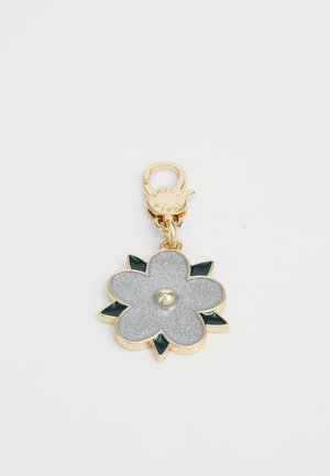 Gold-tone flower keychain with silver glitter petals, dark green leaves, and a clasp engraved with "Furla" lettering.