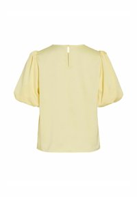 Blouse jaune à manches courtes bouffantes avec une ouverture en goutte d'eau dans le dos. Texture lisse et coupe ample.
