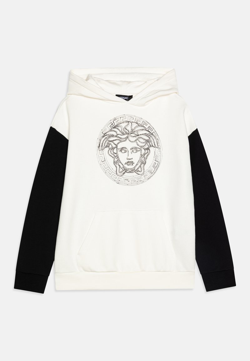 White hoodie with black sleeves, featuring a central graphic of Medusa and a Greek key pattern. Made from soft fabric with a front pocket.