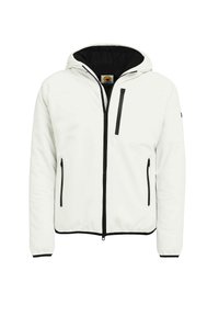 Giacca con cappuccio bianca con dettagli neri, dotata di cerniera frontale, due tasche laterali con zip e una tasca sul petto. Texture liscia, design leggero.