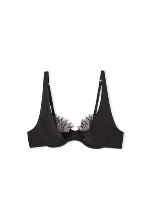Soutien-gorge noir avec des détails en dentelle le long du décolleté, bonnets lisses, bretelles ajustables et soutien par armatures. Sans rembourrage.