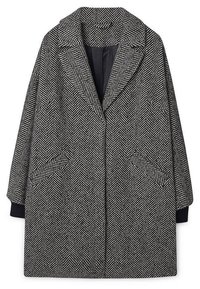 Houndstooth jas in zwart-wit, met een notch-kraag, twee zijzakken en een losse, oversized pasvorm. Textuurstof.